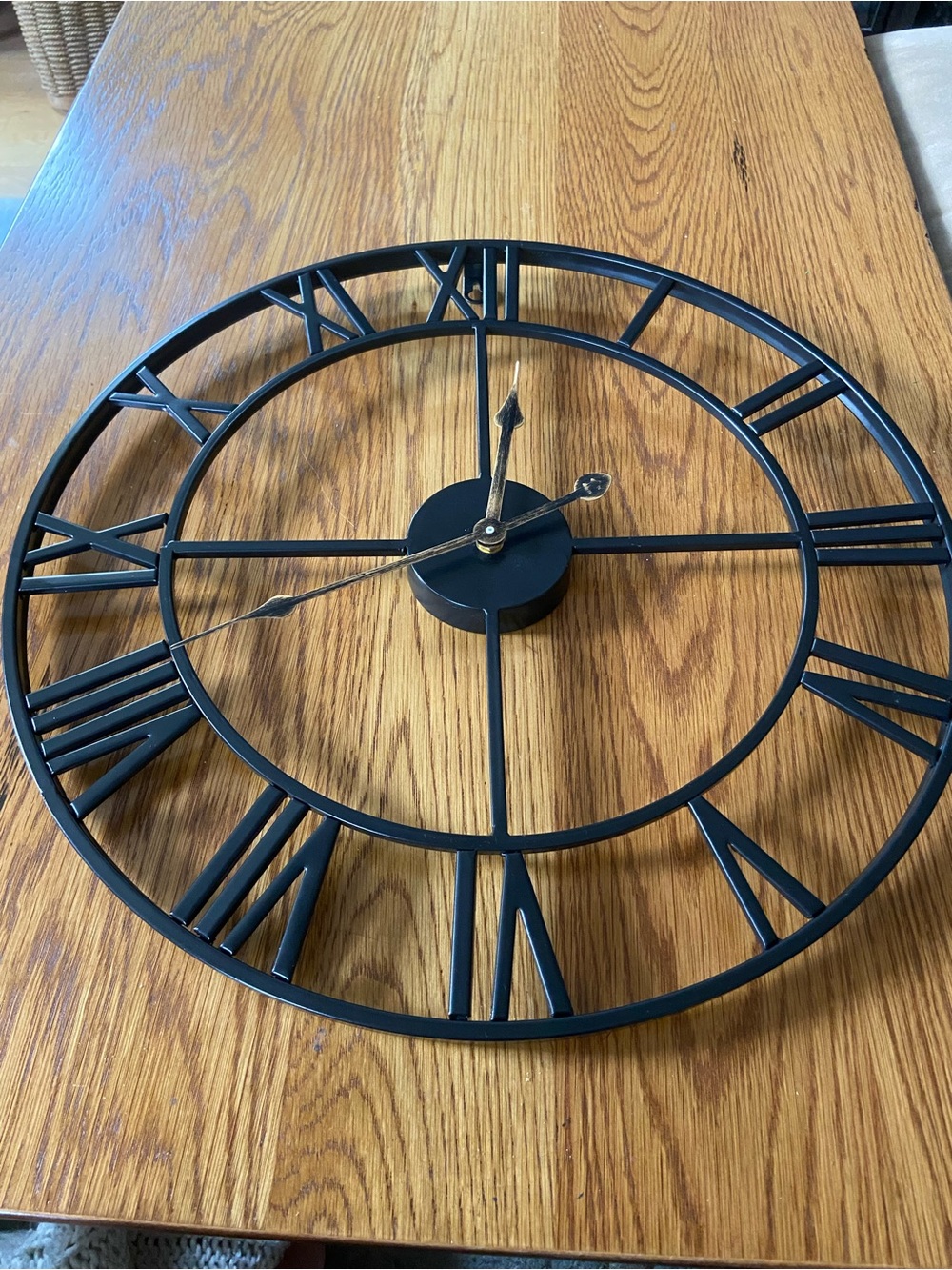 Black Metal Skeleton Roman Numeral Wall Clock